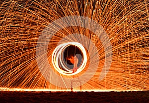 Fireman Show on the beach dance man juggling with swing fire spa