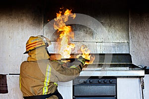 Fireman trying to put an oil fire