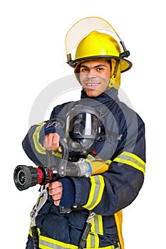 Fireman in uniform and hardhat holds firehose in hands