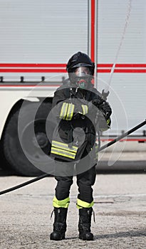 Fireman uses a fire extinguisher to extinguish a  fire
