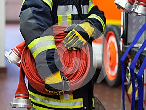 A Fireman with water hose