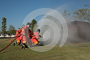 fireman watering against fire