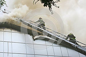 Fireman wearing a gas mask on the stairs