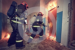 Firemans team during firefighting