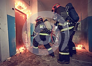 Firemans team during firefighting