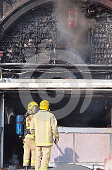 Firemen assessing damage