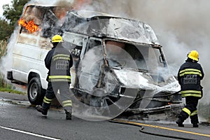 Firemen and Burning Motor Car