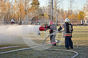 The firemen extinguishes the fire with foam on firemen training