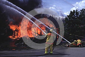 Firemen fighting house fire