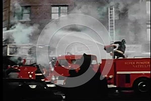 Firemen hosing burning building