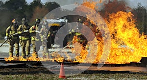 Firemen putting out fire photo