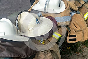 Firemen`s helmets clothing firefighters on the street