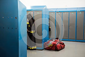 Firemen`s locker room, uniforms and bags next to the lockers. Firefighter uniforms on Lisbon, Portugal