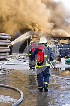 Firemen support to go fight the plant fire