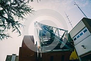 Firemen at the top of the truck ladder performing an emergency