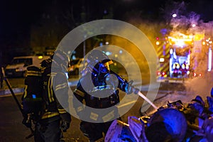 The firemen work in a night fire. Madrid Spain.