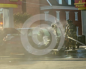 Firemen Work on Overheated Car