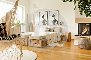 Fireplace in boho bedroom interior photo