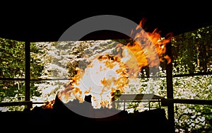 Fireplace with the burning fire in the nature.