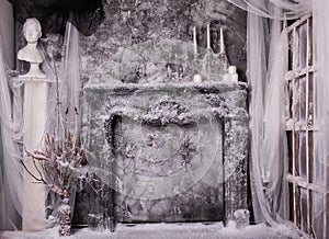 Fireplace with candles in gloomy colors