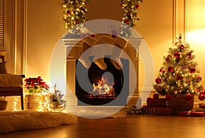 Fireplace with Christmas stockings in beautifully decorated living room