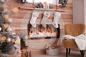 Fireplace with Christmas stockings. Festive interior