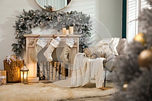 Fireplace with Christmas stockings in room interior