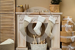 Fireplace with Christmas stockings in room interior