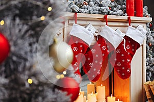 Fireplace with Christmas stockings in room interior