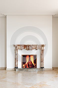 Fireplace detail with lit fire