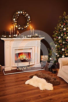 Fireplace and gifts under the Christmas glowing tree