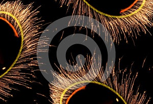 Fires of pyrotechnics on black.
