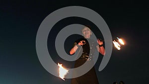 Fireshow performance with burning torch at night outdoor 4k