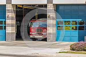 Firestation House with firetruck in open bay