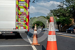 Firetuck and orange cone on roadside