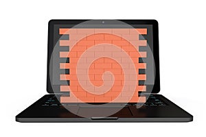 Firewall concept. Laptop with brick wall