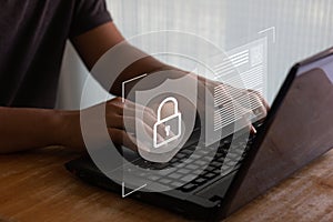 Firewall and internet security concept. Business person working on laptop computer with the sign of cyber security, secured access