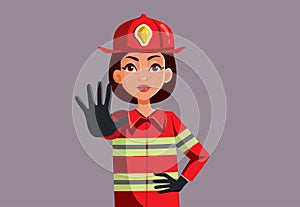 Firewoman Making a Stop Sign Warning about Fire Hazards Vector Cartoon