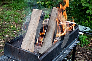 Firewood burning on Grill Open fire Close up Outdoor Barbecue Horizontal