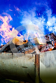 Firewood in grill photo