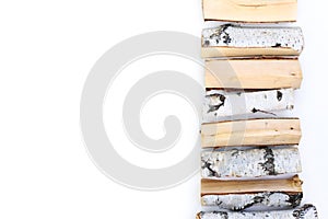 Firewood isolated on white background. Line of wood birch logs, bonfire. Closeup, top view