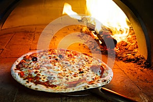 Firewood oven pizza photo