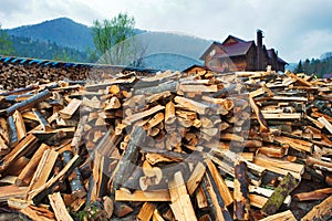 Firewood pile near wooden house