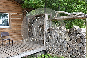 Firewood for the sauna stove, saunas are stacked next to the wooden rural bath. For lifestyle design