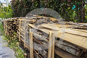 Firewood. Stack of Wood. Heaps of Firewood Near a Natural Wood Wood Processing Factory