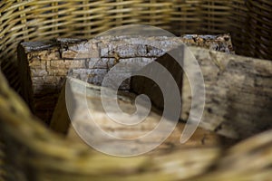 Firewood on a wicker basket photo