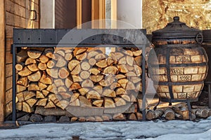 Firewood for the winter. Firewood for barbecue. A background made of wood. Cut and chopped logs with ready-made pieces of wood for