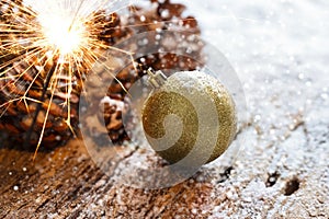 Firework or electric sparklers on christmas ornament pine cones