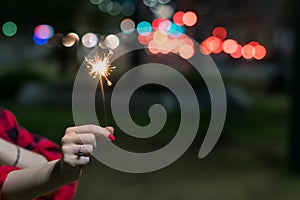 Firework in hand on defocus background