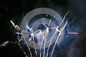 Firework light trails creating a windmill effect